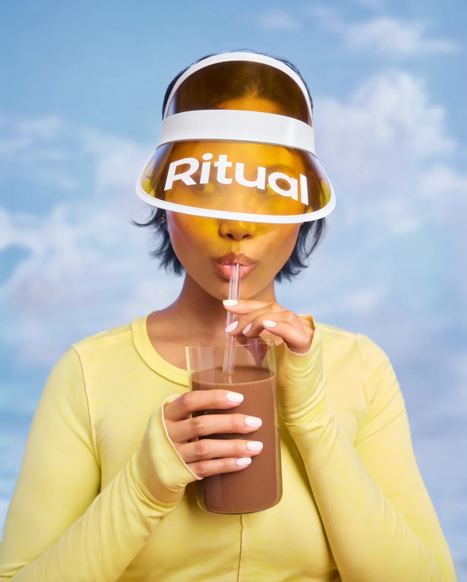 Athlete drinking chocolate protein from a cup