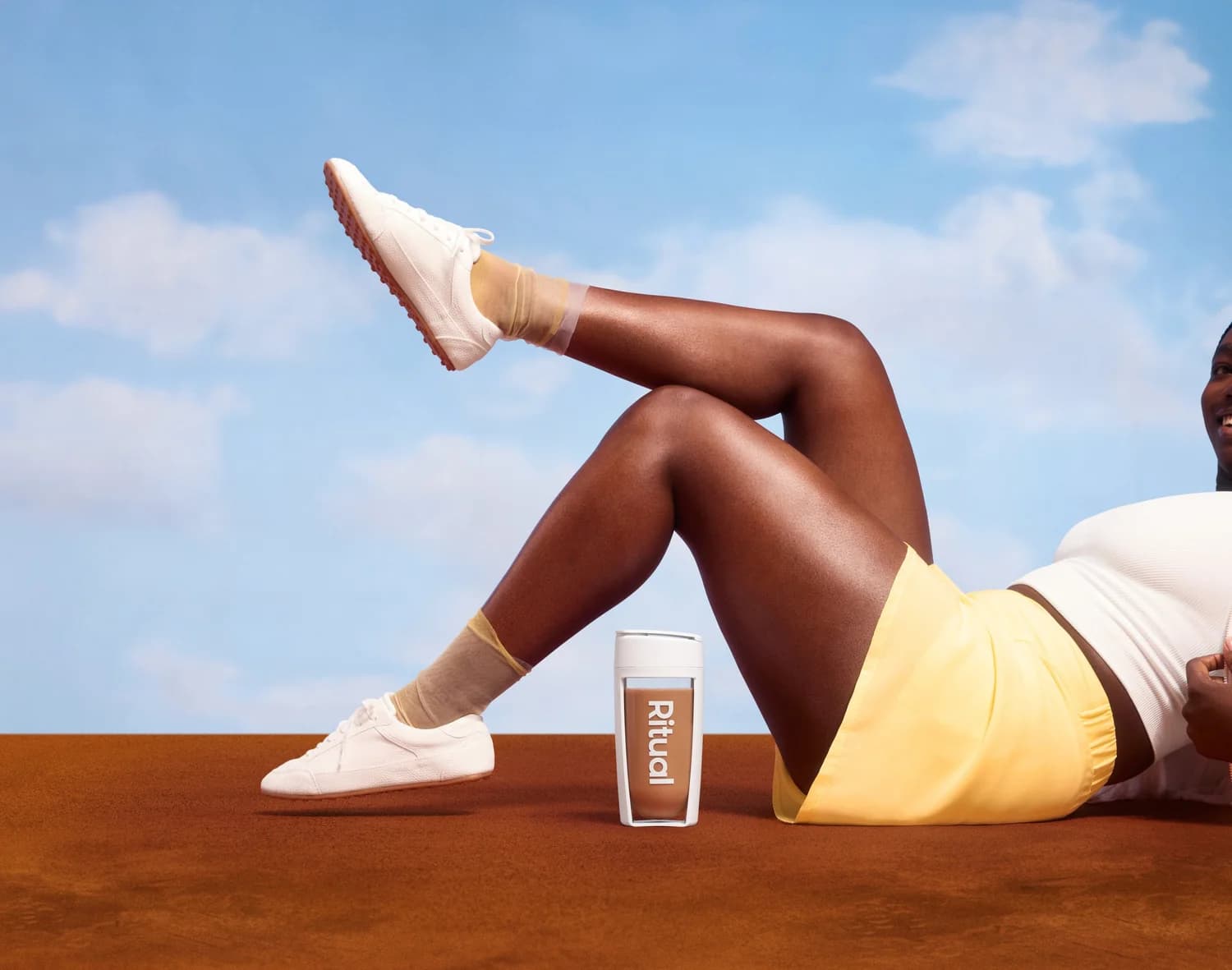 Ritual Chocolate Protein beside training shoes